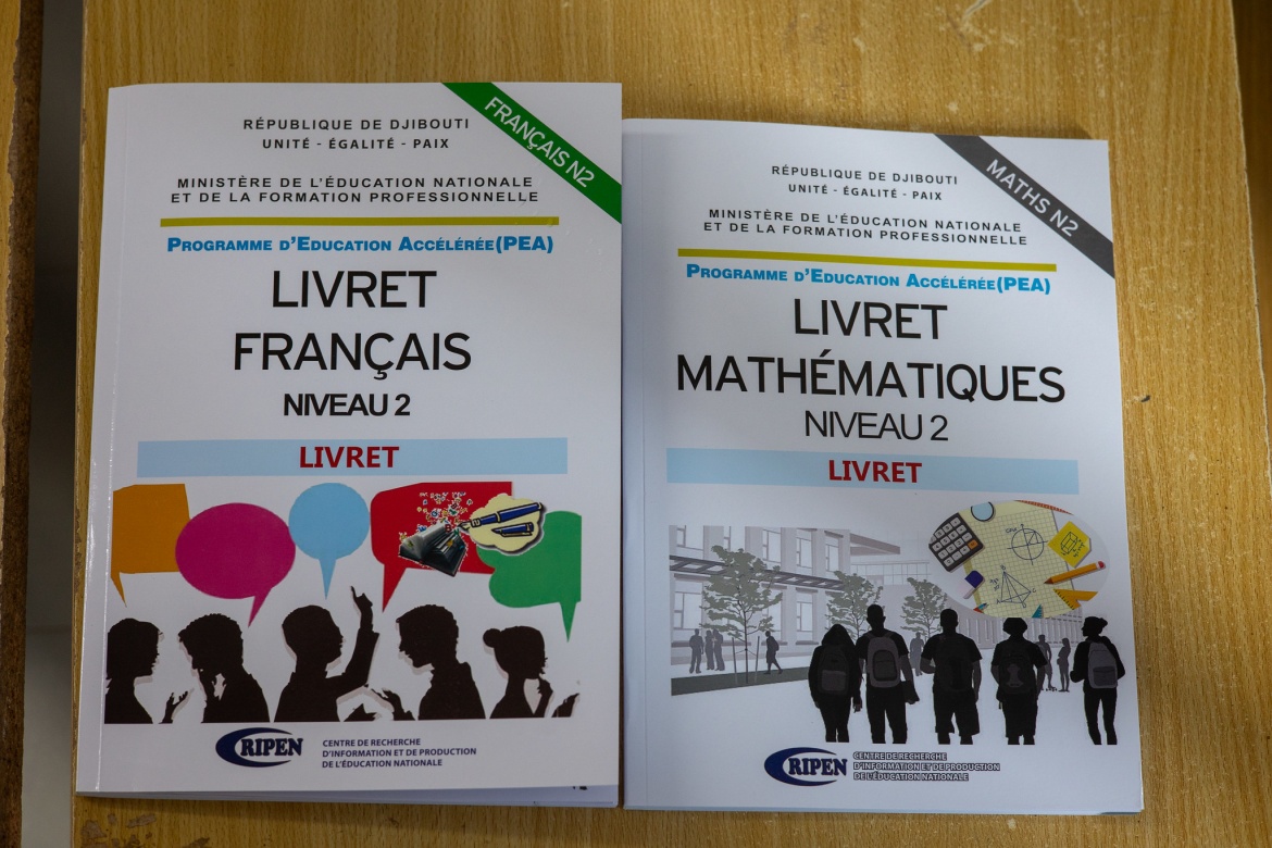 Some of the textbooks developed for students participating in the accelerated education program, supported by GPE-funds through PRODA. Credit: GPE/Federico Scoppa