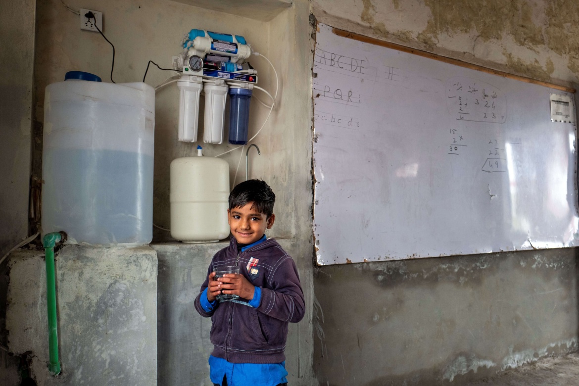 A student at the Government Elementary School Manak Lahore drinks water that has been filtered through the new "RO plant" (reverse osmosis filtration system). 