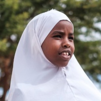 13-year-old student Hamda in between lessons outside Booldid Primary School. Credit: GPE/AP