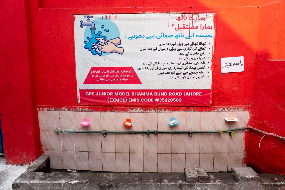 The handwashing station at the Government Primary School Junior Model Bhamma in Lahore has messages about good hygiene practices.