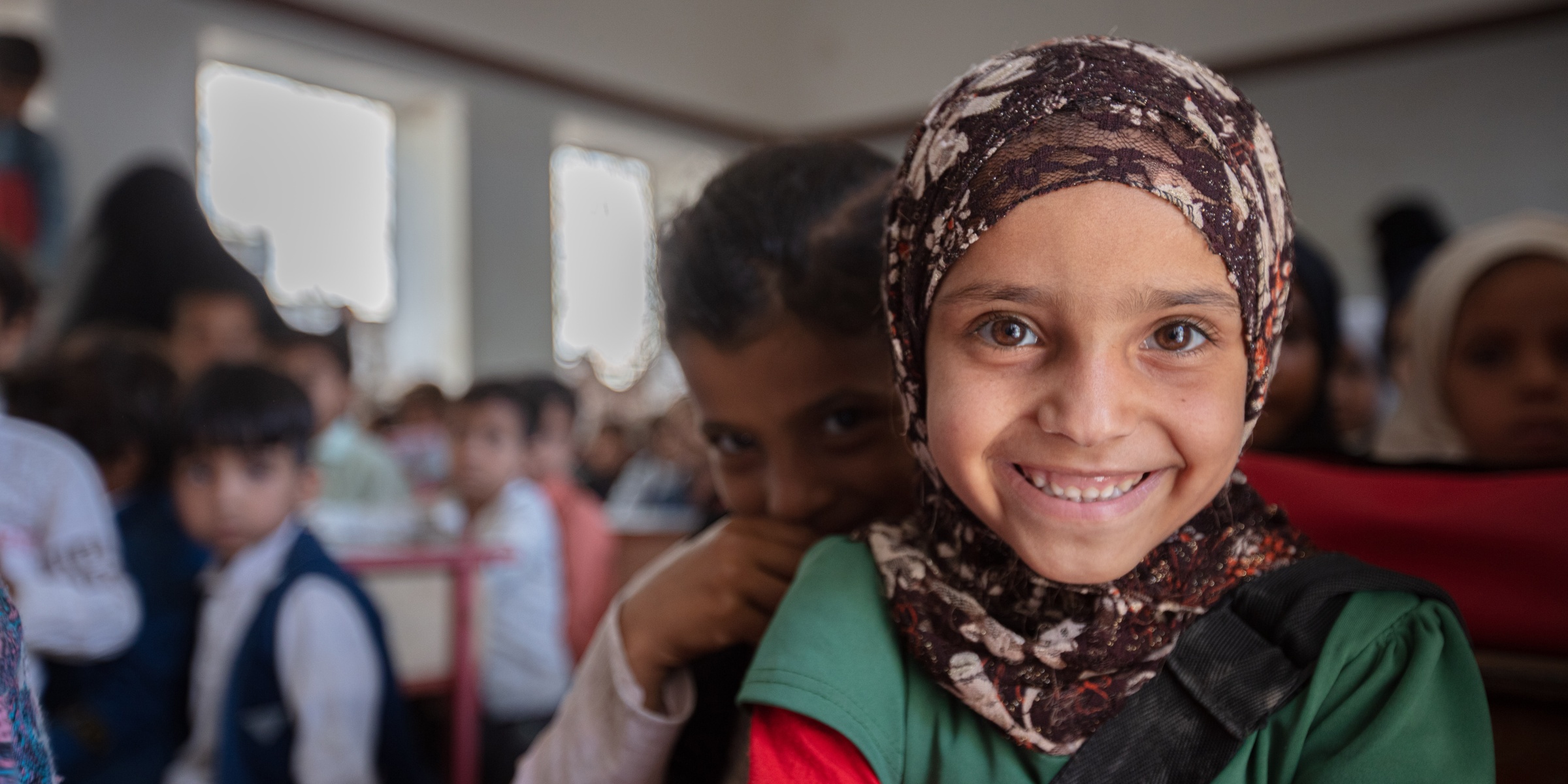 First grader at Al-Hamzi school, smiling to the camera, Hajjah, March 2021. Credit: UNICEF/UN0459559/Marish