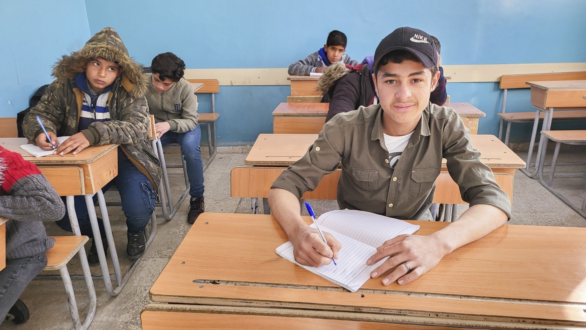 Mohamed, 17, participating in a mathematics class as part of a UNICEF-supported self-learning program at a school in Kasmieh village, Rural Damascus, Syria. Credit: UNICEF/UNI517404/Sandra Awad